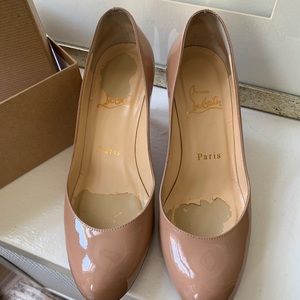 Christian Louboutin about 2.5 inches high